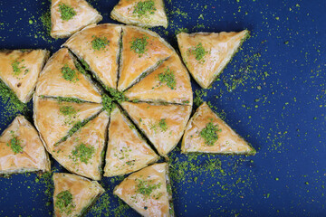 slices Baklava Turkish Dessert ramadan with blue background