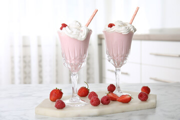 Poster - Tasty milk shake with whipped cream and fresh berries on white marble table