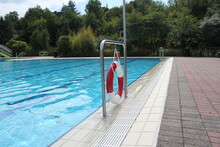 Big Empty Swimming Pool In Summer With Lifebuoy