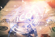 © peshkova - Multi exposure of crypto theme drawing over us dollars bill background. Concept of blockchain success.