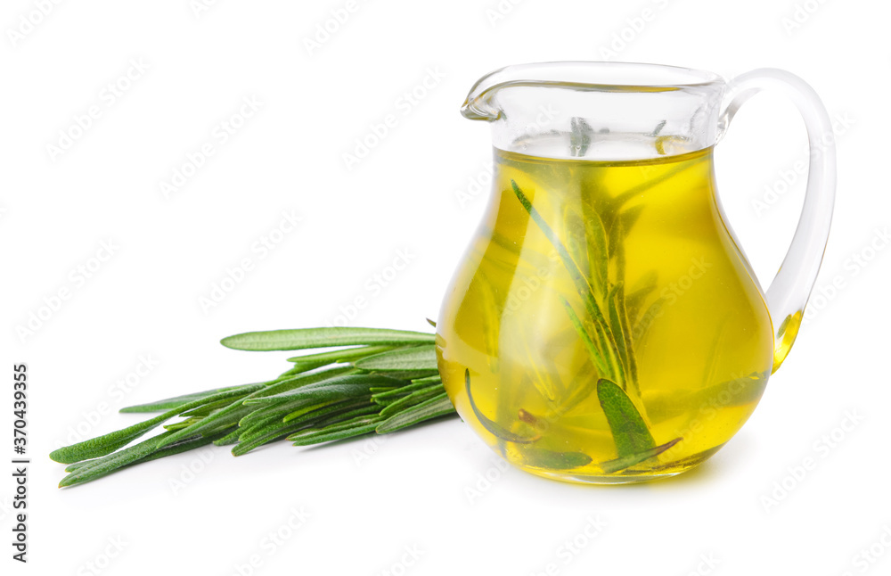 Jug of rosemary oil on white background