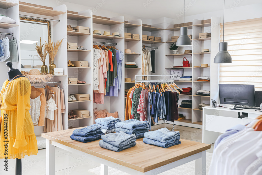 Stylish interior of modern clothes store