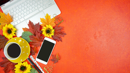 Wall Mural - Autumn Fall Halloween Thanksgiving theme desktop workspace with laptop on stylish orange textured background. Top view blog hero header creative composition flat lay.