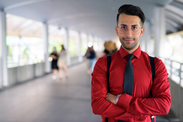 Wall Mural - Young handsome Persian businessman exploring the city