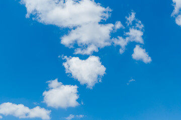 Wall Mural - blue clear sky with white fluffy clouds. natural background
