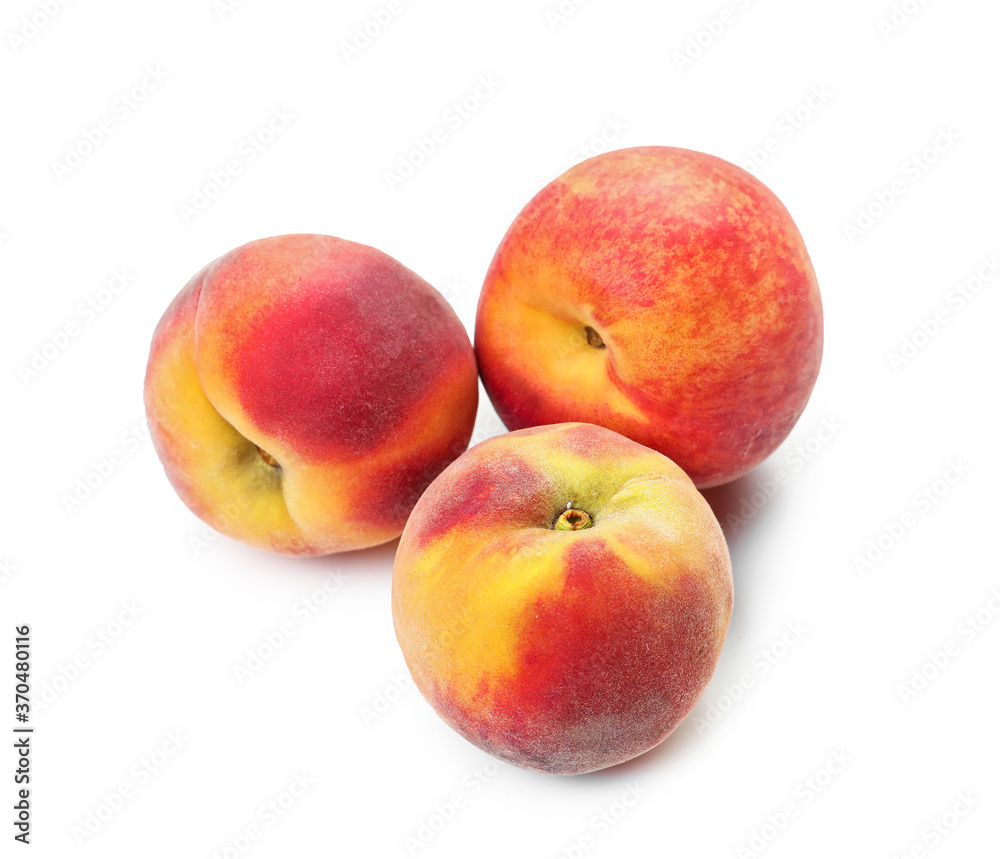 Sweet ripe peaches on white background