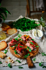 Canvas Print - Crostini with steak  with roasted bell pepper. style rustic