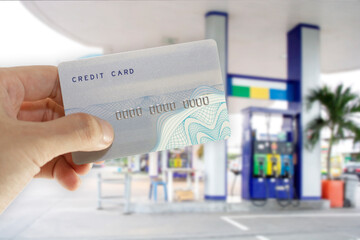 Credit card with mobile phone to make a payment for refueling car on gas station