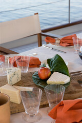 Deck of a classic wooden sailing yacht. Netherlands. Dinner table laid.