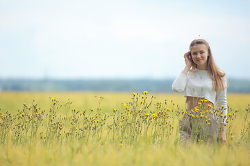 autumn field girl health / beautiful young model, landscape in a summer field, cute happy model