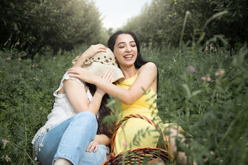 two happy girlfriend  in garden