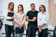© standret - Group of business people in formal clothes standing indoors in the office together