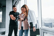 © standret - Group of people standing indoors together and looks at photos on camera