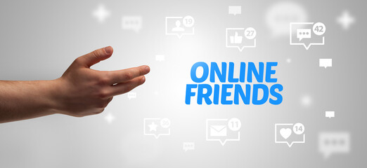 close-up of cropped hand pointing at online friends inscription, social networking concept