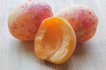 half apricot with two apricots close-up 