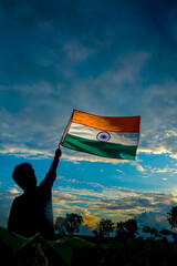 India flag being waved by a man , celebrating Independence or Republic day of India