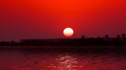 Canvas Print - Panorama of the sea landscape with a red sunset on the background of the city