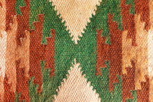 Knitted Ethnic Ornament Pattern. Abstract Craft Woven Textile Rug Interior Details. Close-up Texture Carpet