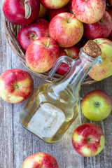 Fresh red apples and apple cider vinegar