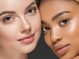 Wall Mural - different ethnic american african and caucasian woman beauty face portrait