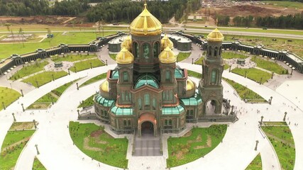 Wall Mural - dark color temple with golden domes with geometric park from drone height