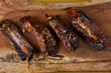 Pork ribs, barbecue style. Classic Traditional Texas Smokehouse favorite menu item: Baby Back pork ribs. Slow cooked in seasoned smoker over mesquite wood chips covered in homemade bbq sauce.