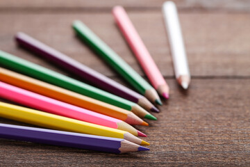 Wall Mural - Colored pencils on brown wooden table