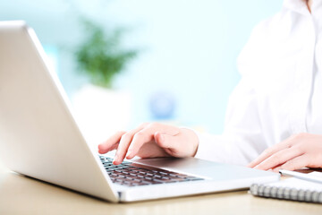 Poster - Female hand typing on laptop keyboard