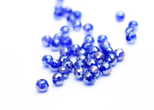 Blue Round Beads On A White Background. Beads To Create Jewelry And Accessories. Sewing Accessories.