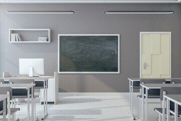 Bright classroom interior with empty blackboard
