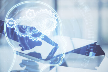 Poster - Hand using tablet with glowing head with cogs.