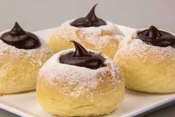 Wall Mural - Sweet bread stuffed with dulce de leche (doce de leite). Traditional Brazilian sweet.