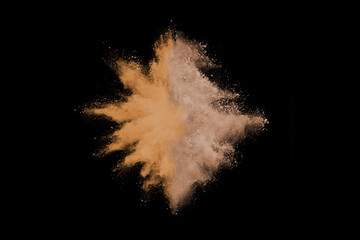 Wall Mural - Gold sand explosion isolated on black background. 