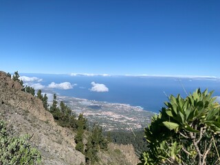 Landscape view of full forest mountains under blue skies