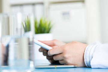 Close up of doctor hands using tablet computer