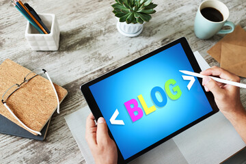Wall Mural - tablet with blog text the on screen. social network, communication and internet marketing concept.