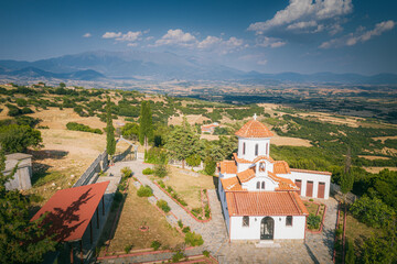 Wall Mural - Greek Orthodox church in the Villge of Sarantaporo and Mount Olympus, Greece