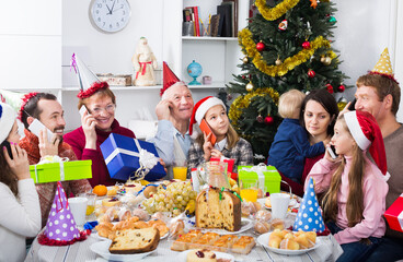 Wall Mural - Large family happy to see each other during delicious Christmas dinner