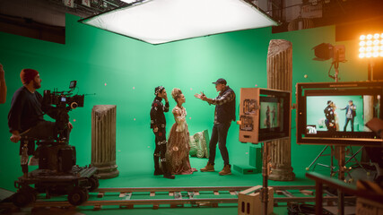 Wall Mural - On Big Film Studio Professional Crew Shooting Period Costume Drama Movie. On Set: Director Explains Scene to Woman Actress Playing Renaissance Lady and Actor Wearing Motion Capture Suit