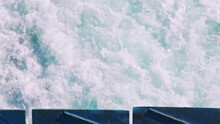 Tilt Shot Of Churning Sea Waters Behind A Ferry Boat Traveling 120fps
