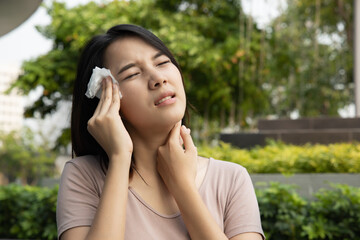 sweating woman in hot summer with tropical high and humid weather