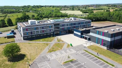 Wall Mural - Cleckheaton UK, 29th May 2020: Aerial drone photo of the Whitcliffe Mount Primary School, showing an aerial photo of the British school building on a bright sunny summers day