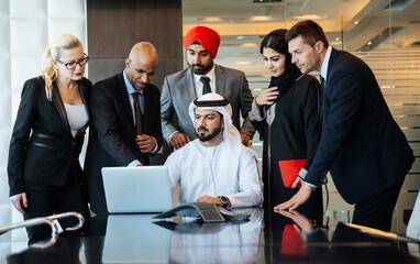 Mixed business team making agreements on future business plans. in the office