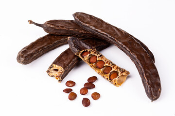 Wall Mural - Dried carob on the white background