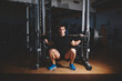 © BullRun - Young professional bodybuilder working out doing squats with barbell