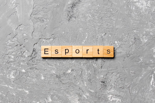 Esports word written on wood block. Esports text on cement table for your desing, Top view concept