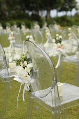 Wedding arch, chairs for guests, wedding accessories and decorations. Wedding ceremony. Beautiful wedding setup.