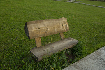 wooden bench on a green background photo from the side