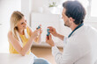 © Westend61 - Doctor explaining using of asthma inhaler