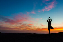 Silhouette Of Man Doing Yoga At Sunset, Gran Canaria, Spain